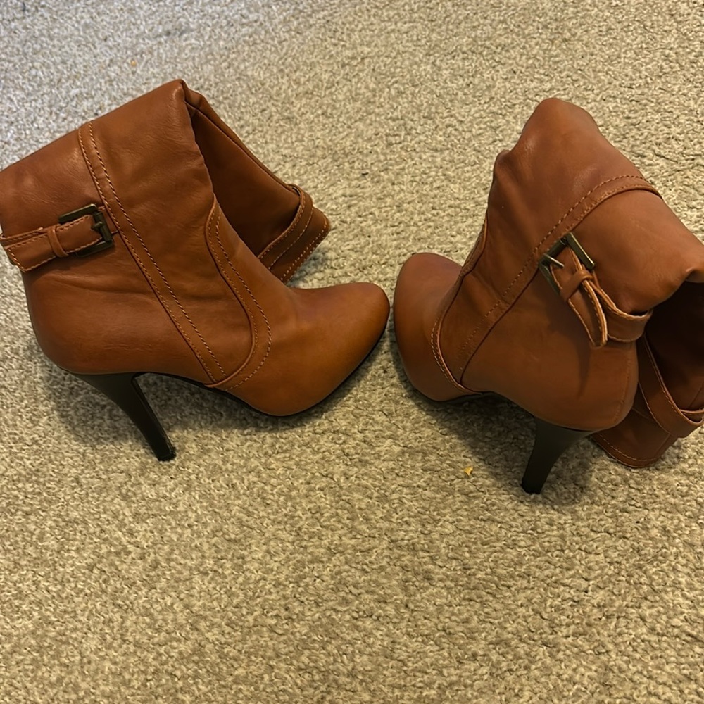 Brown knee high heeled boots